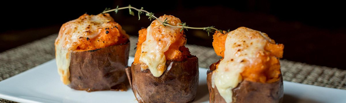Twice-baked potatoes with melted cheese topping